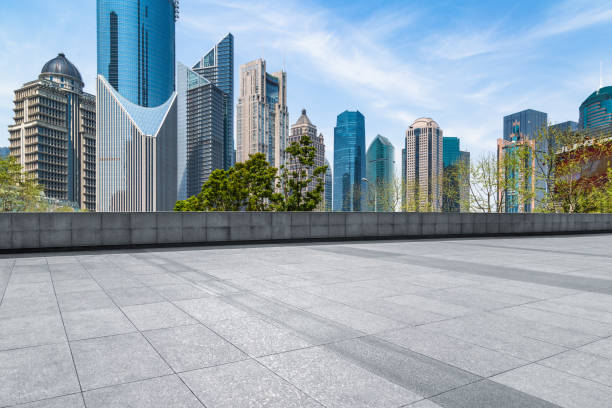 istock Empty brick floor with city skyline background 858591658