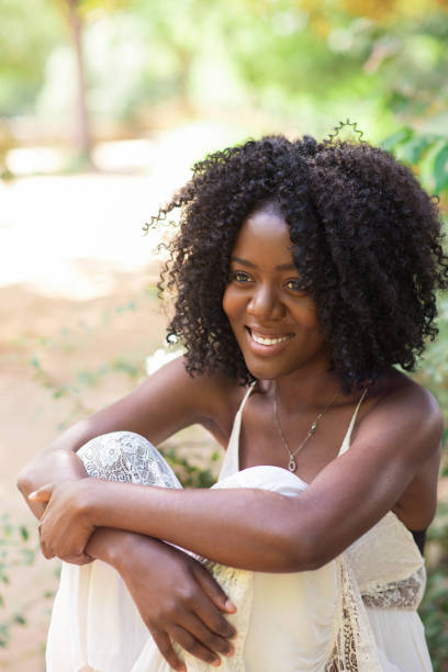 istock Smiling Young Black Woman Relaxing in Park 858591798