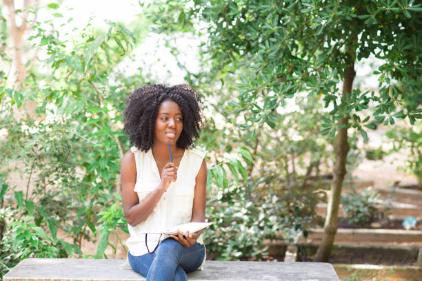 istock Smiling Young Black Woman Working in Park 858591824