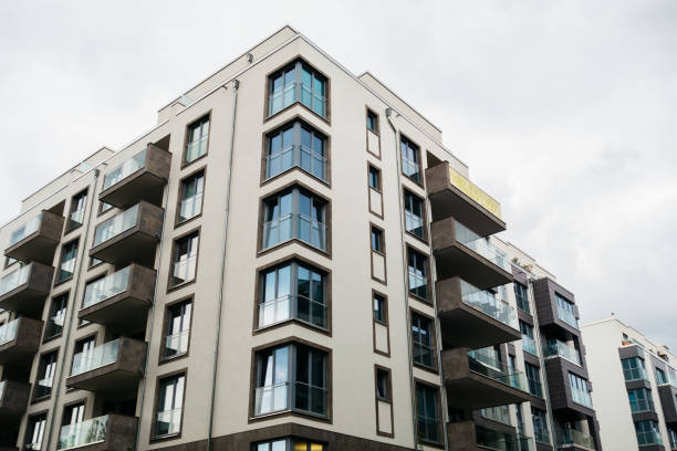 istock modern apartment building with glass balcony on a cloudy day 858594320