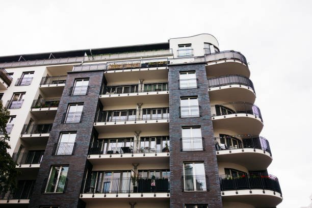 istock modern and darken colored building with curved balcony 858596764