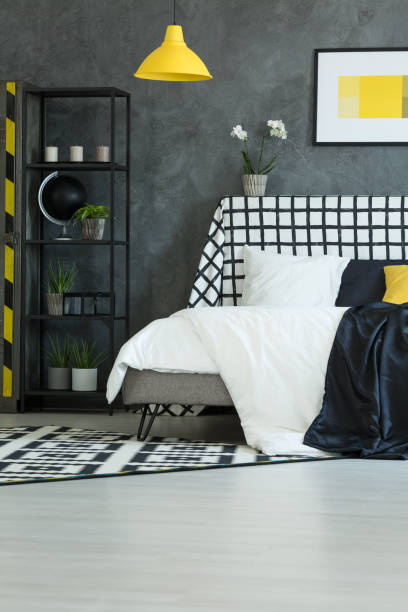 istock Contrast bedroom with yellow lamp 858599446