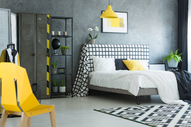 istock Yellow designer chair in bedroom 858599450