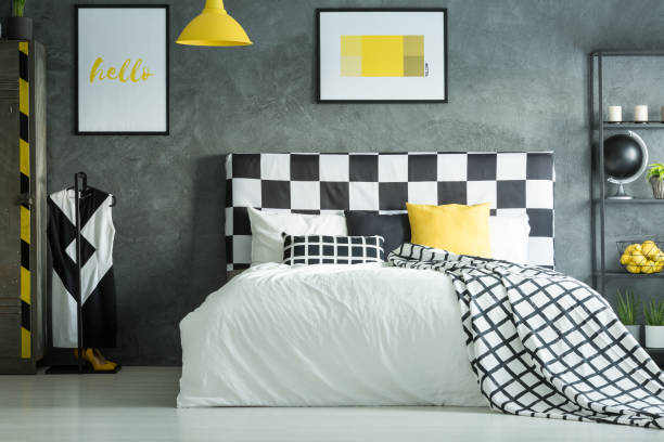 istock Yellow accent in dark bedroom 858599556