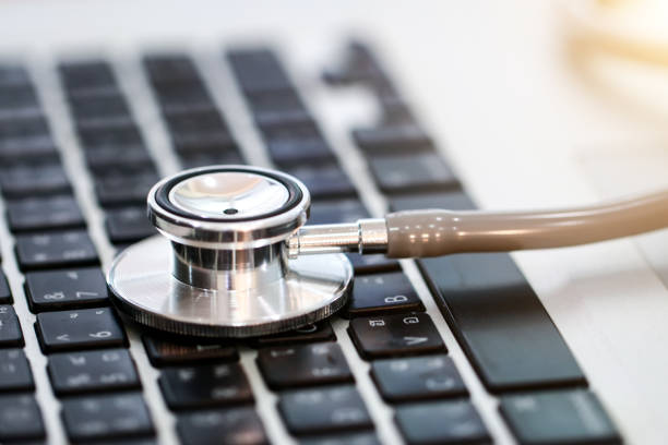 istock Medical stethoscope lying on laptop keyboard 858600146