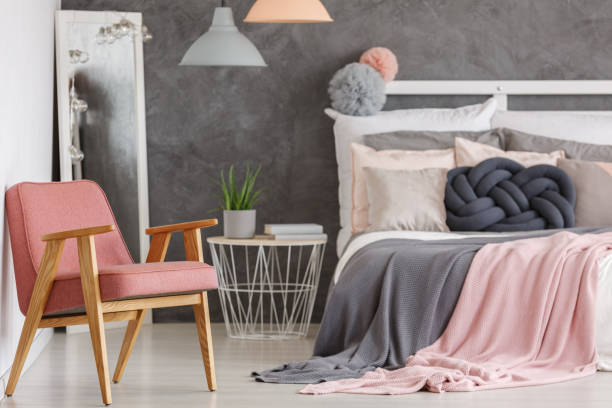 istock Pretty pink bedroom with chair 858602938