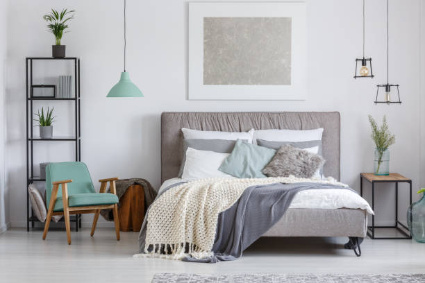 istock Adorable bedroom with mint chair 858603002