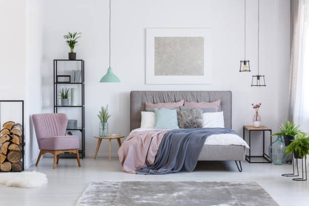 istock Pastel bedroom with comfortable chair 858603022
