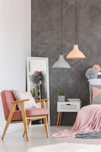 istock Vintage pink chair in bedroom 858603064