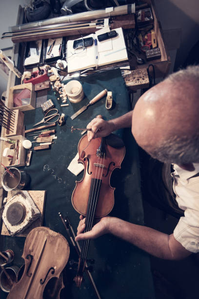 istock Skill and expertise is needed to make one quality violin 858603424