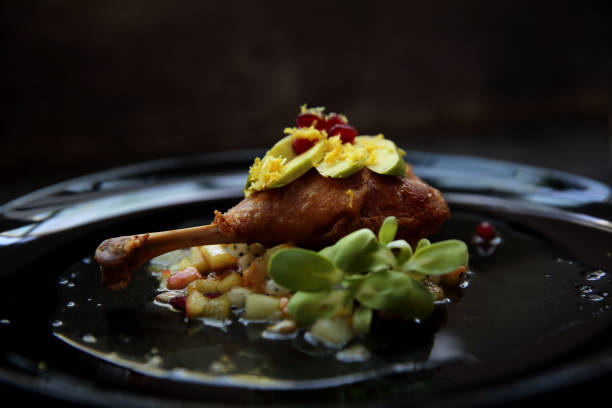 istock duck confit in black tone food 858610546