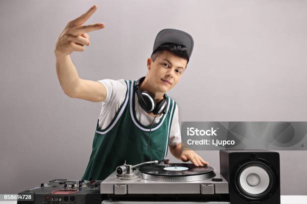 Teenage Dj Making A Peace Sign Stock Photo - Download Image Now - DJ, Rap, Hip Hop Music