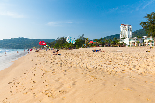 Phuket, Thailand - April 17, 2016: People rest at the Karon Beach on April 17, 2016 in Phuket, Thailand