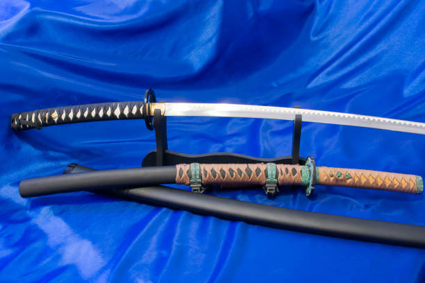Japanese katana sword. The weapon of a samurai. A formidable weapon in the hands of a master of martial arts. Japanese katana sword. The weapon of a samurai. A formidable weapon in the hands of a master of martial arts. harakiri photos stock pictures, royalty-free photos & images