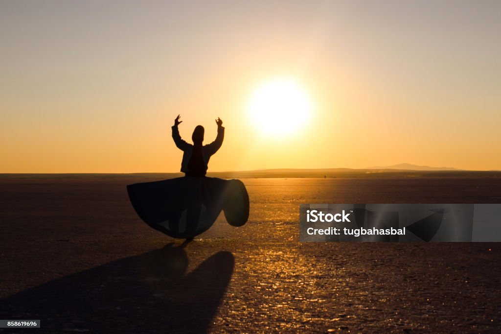 Dancing with the sun...Salt Lake, Turkey Whirling dervish, Ishak Urun at the Salt Lake, Turkey Sufism Stock Photo