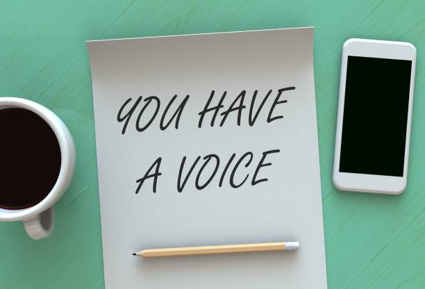 istock You Have A Voice, message on paper, smart phone and coffee on table, 3D rendering 858622202