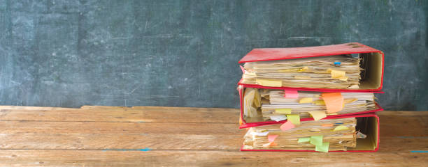 istock messy file folders, on grungy background 858625954