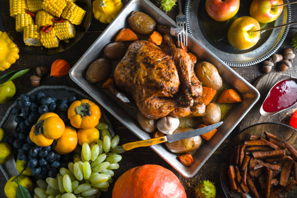 Feast with turkey on Thanksgiving, vegetables and fruits stock photo