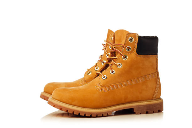 istock yellow winter boots isolated on white 858630938