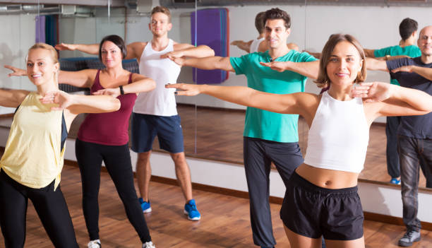 istock Men and ladies dancing zumba 858633828