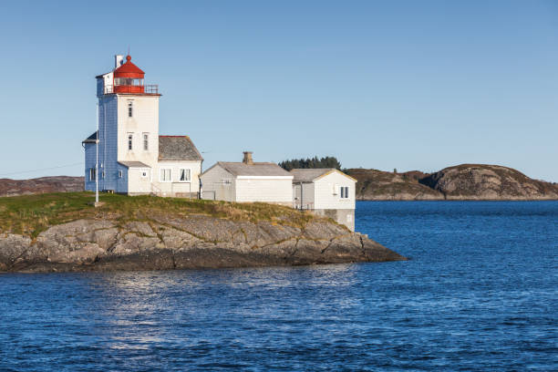 istock Tyrhaug, white tower with red navigational light 858635182
