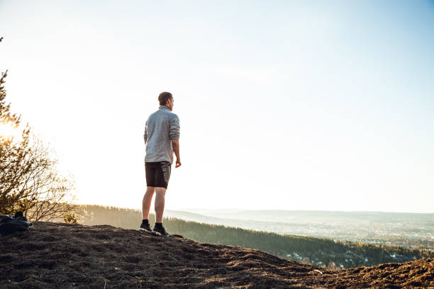 istock Man looking at view in early morning after jogging 858635500