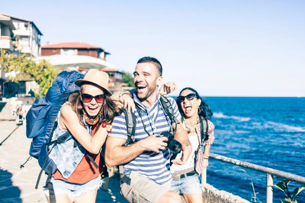 istock Friends having fun near the sea 858635552