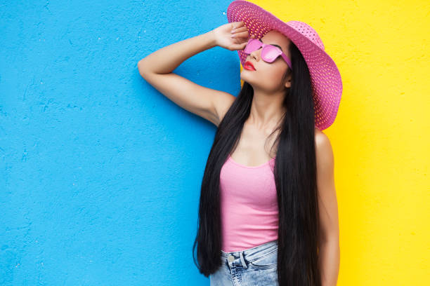istock Smiling young woman in pink outfit 858638022