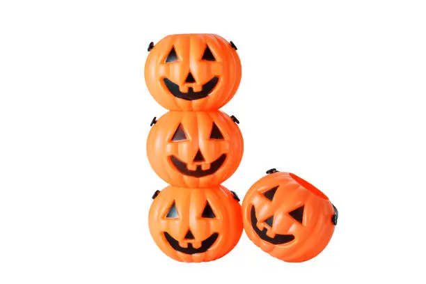 Photo of Light plastic Halloween pumpkin buckets isolated on white background