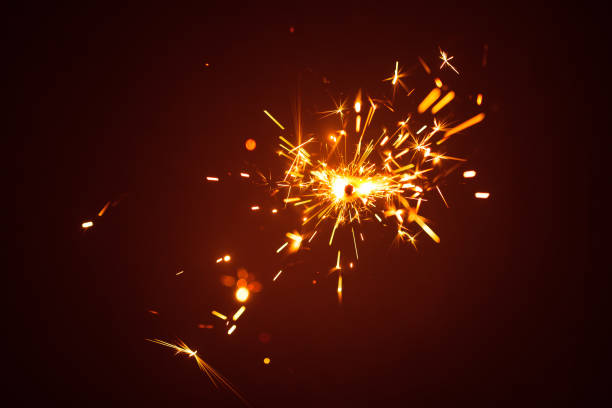 istock Christmas sparkler in haze with red light 858643052