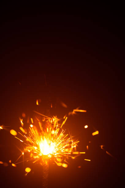 istock Christmas sparkler in haze with red light 858643612