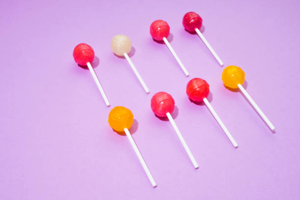 istock Colorful Lollipops on pink background 858645936