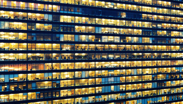 istock Office workers working late in major office building 858655160