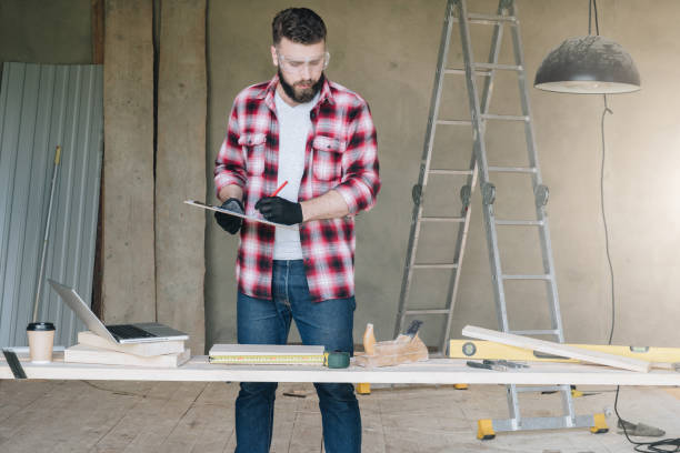 istock Hipster man is carpenter, builder, designer stands in workshop, 858658222