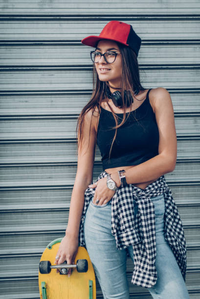 istock Urban woman with longboard 858662384
