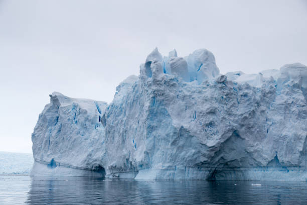istock A huge iceberg has calved from a glacier. Showing beautiful blue ice 858662816
