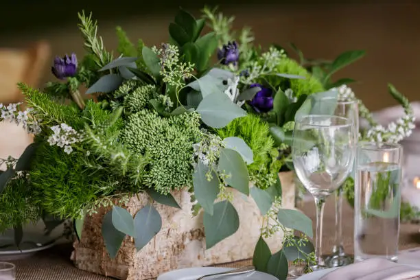 wedding table centerpiece with a lot of green