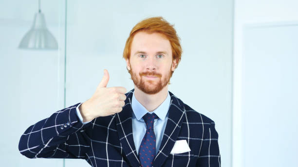 thumbs up by redhead businessman with red hairs - 11877 imagens e fotografias de stock