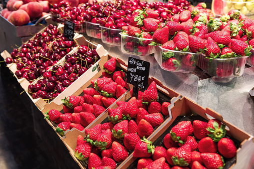 Assortment of summer fresh organic berries on market. Local farmers produce. Autumn harvest. Horticulture industry