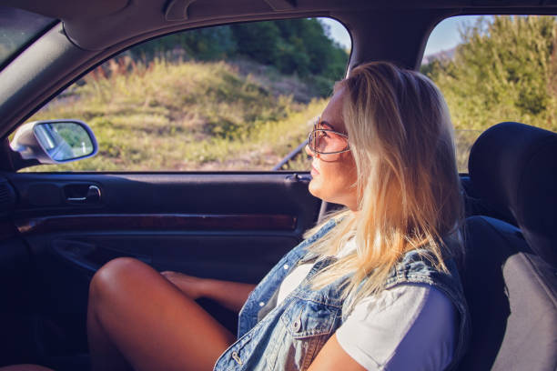 istock Woman traveling in car 858671732