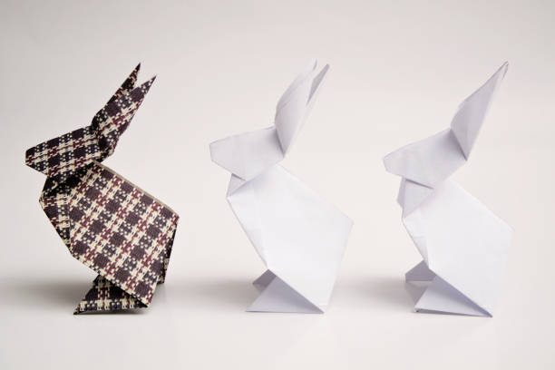 Origami rabbit on blue background