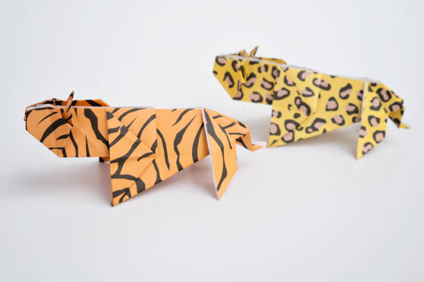 A tiger and a leopard origami with white background