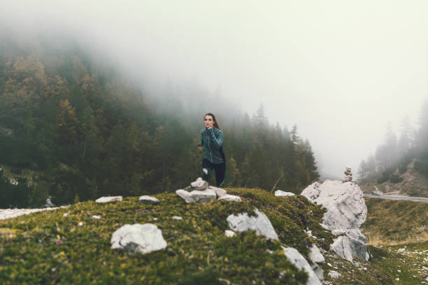 istock Female running  in mountains 858674950