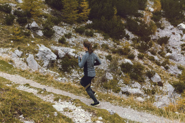 istock Female running  in mountains 858675084