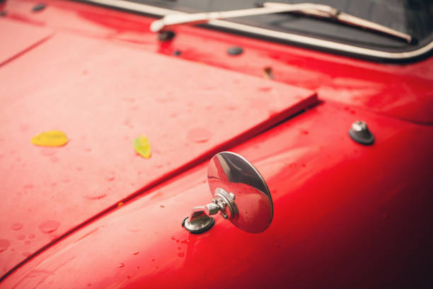 istock side mirror and bonnet on old red car in rainy day, vintage concepts 858675320
