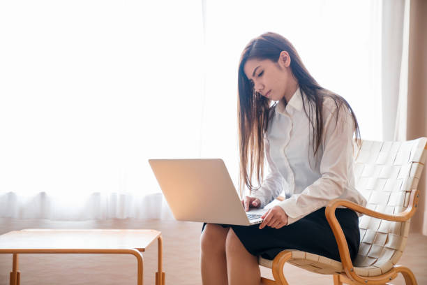 istock Woman working inside a hotel room 858681806