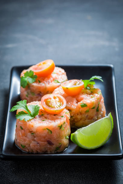 istock Fresh salmon tartare with lime and cherry tomatoes 858683144
