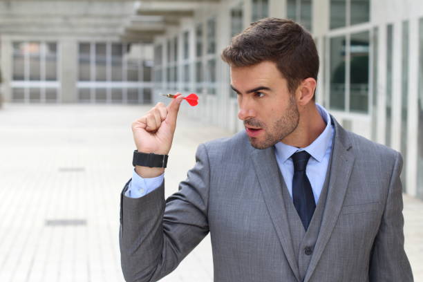 istock Focused businessman holding a dart 858688814