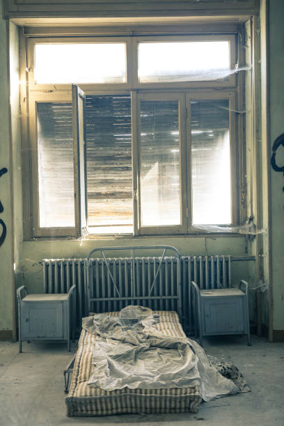 istock Dirty bed inside an abandoned house 858688854