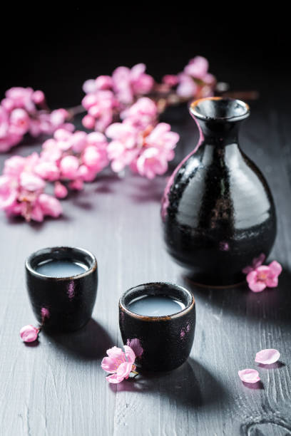 istock Traditional and delicate sake with blooming flowers 858691386